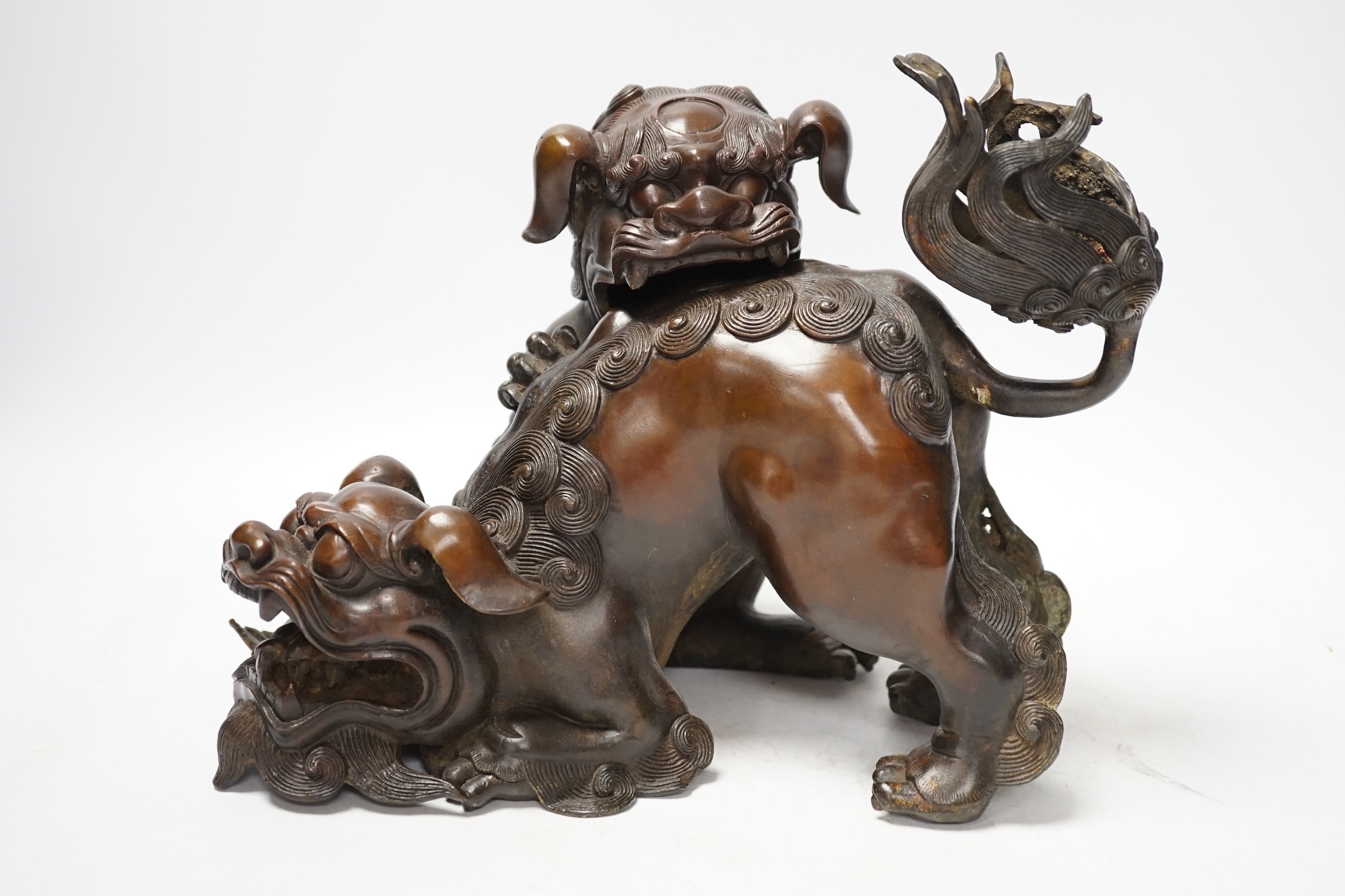 A large Chinese bronze incense burner, modelled as 2 lion dogs playing, 19th century, 22cm high. Condition - good